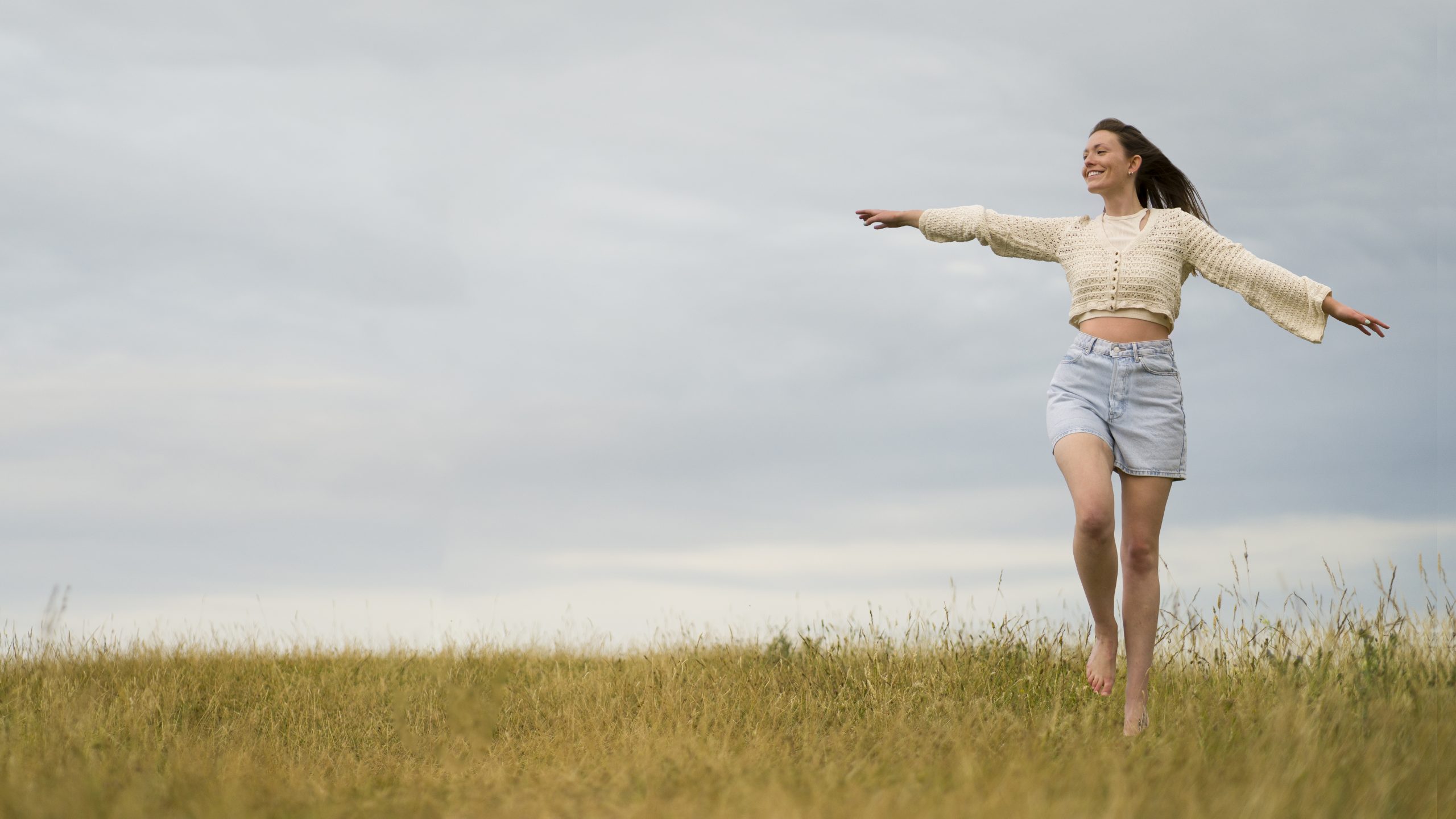 woman-enjoying-nostalgic-sunset-country-side